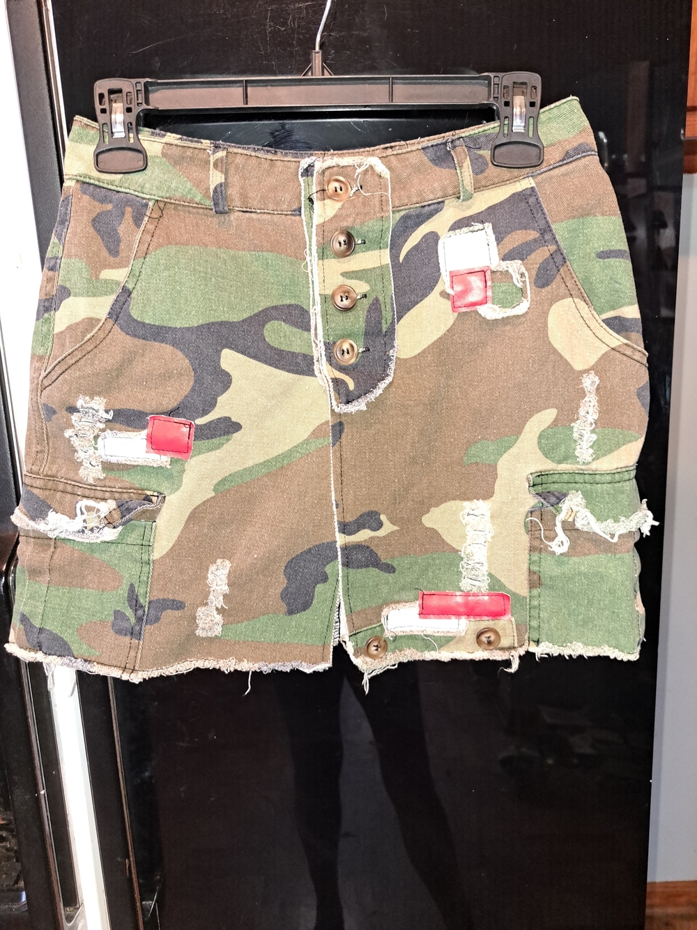 Distressed Camo Mini Skirt with Red Patch Accents